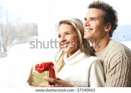 Young couple in love looking in the window
