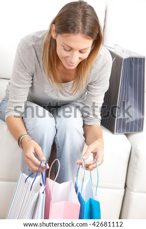Shopping happy  woman sitting on the sofa