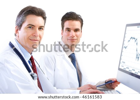 Smiling medical doctors with stethoscopes and computer. Isolated over white background