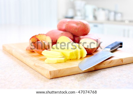 Kitchen, cooking, potato, knife, cutting board, table