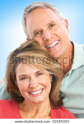 Happy senior couple in love. Over blue background