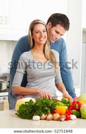 Young love couple cooking at kitchen
