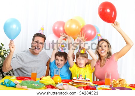 Happy family . Father, mother and children celebrating birthday at home