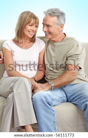 Happy elderly seniors couple. Over blue background
