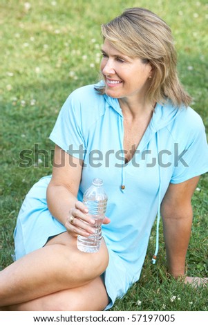 Happy smiling elderly woman in park