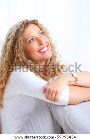 Thinking smiling woman. Isolated over white background