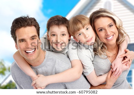 Young family near the new home.  Real estate concept