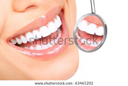 Healthy woman teeth and a dentist mouth mirror Healthy woman teeth and a dentist mouth mirror