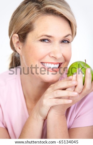 Mature smiling woman with apple