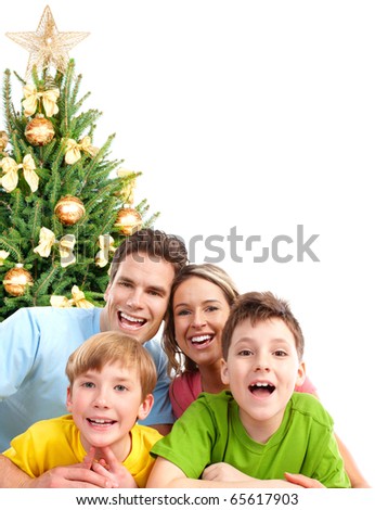 Happy family and a Christmas Tree.