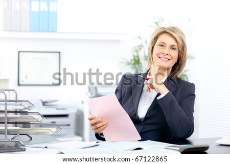 Pretty business woman working in the office