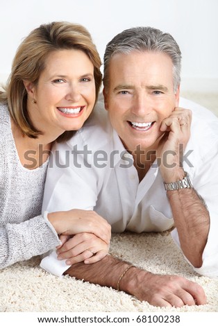 Happy elderly seniors couple in love. Over white background