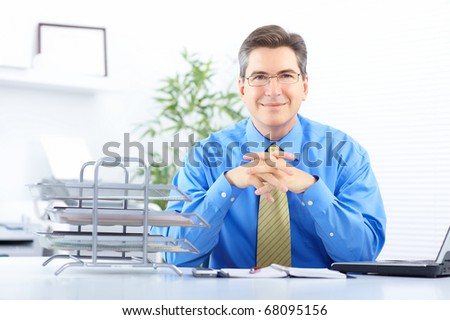 Smiling  businessman working in the office