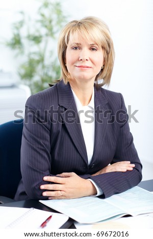 Pretty business woman working at office