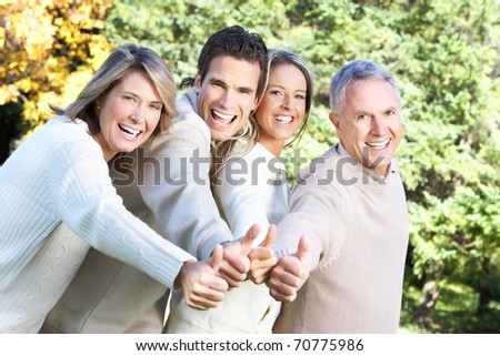 Happy family in park. Father, mother, son and daughter