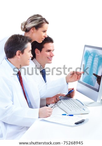 Smiling medical doctors working with a laptop computer. Isolated over white background