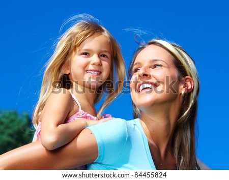 Happy family. Smiling young mother and daughter.
