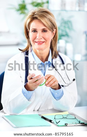 Smiling medical doctor woman. In a modern office.