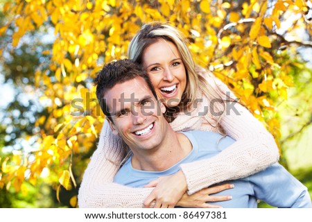 Happy young couple in love at the park.