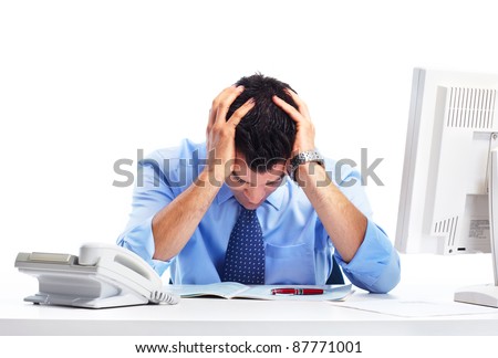 Busy businessman having stress and headache at office.