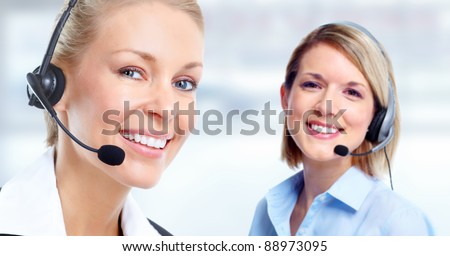 Young Call customer center operator woman with headset.