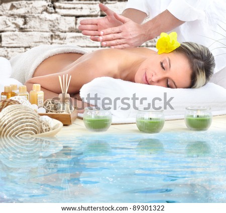 Beautiful young woman getting spa massage.