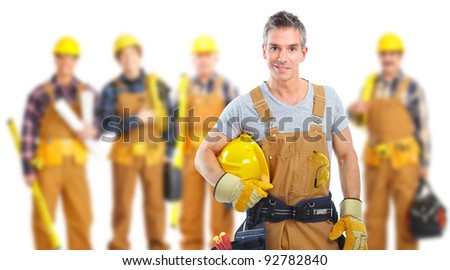 Group of industrial workers with yellow helmet at the construction