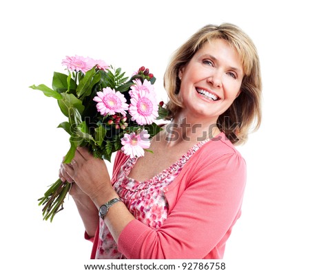 Happy senior woman with bouquet of flowers. Over white background.