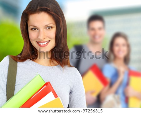 Group of smiling  students and girl with book. University education.
