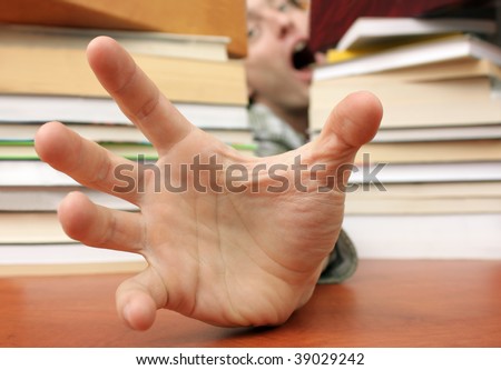 Terrified student needing help (focus on foreground hand)