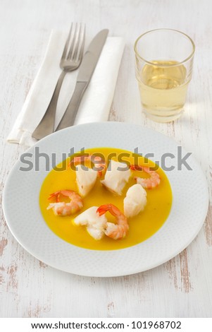fish with shrimps in sauce on the plate