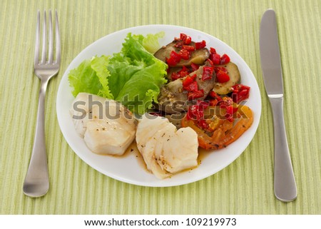 boiled fish in sauce with vegetables