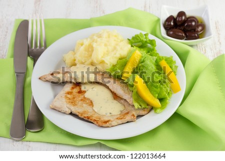 fried turkey with sauce, mashed potato and salad