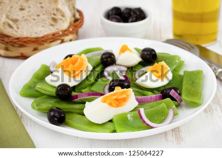 salad with beans, onion, boiled egg and onion