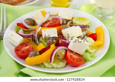 salad with olives and cheese on the plate