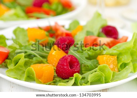 salad with raspberries on plate