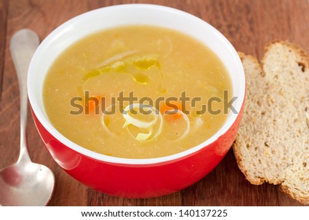 vegetable soup in red bowl