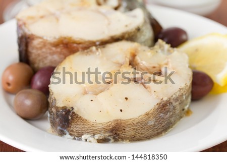 boiled fish with olives