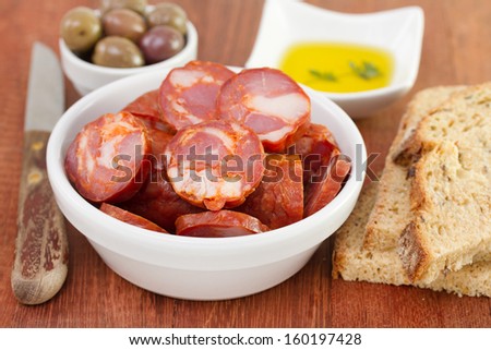 chorizo with olives, bread and oil
