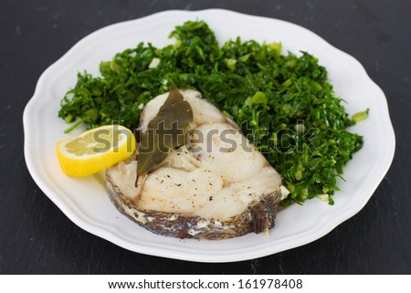 boiled fish with lemon and cabbage
