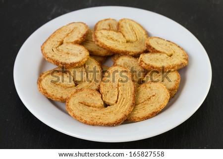 cookies on plate on dark background