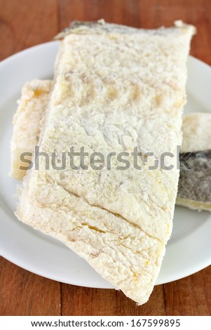 salted cod fish on white plate