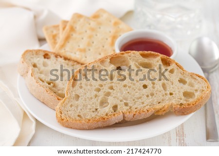 bread, toasts and jam on plate