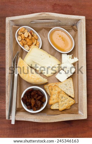 cheese with toasts, nuts and honey