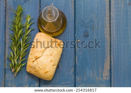 bread and oil on blue background