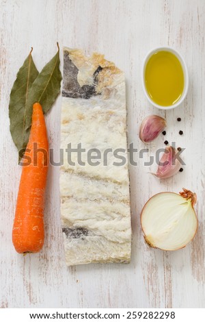 salted cod fish with oil, carrot and garlic