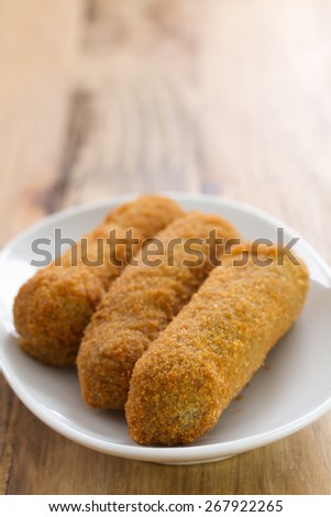 meat croquete on white dish