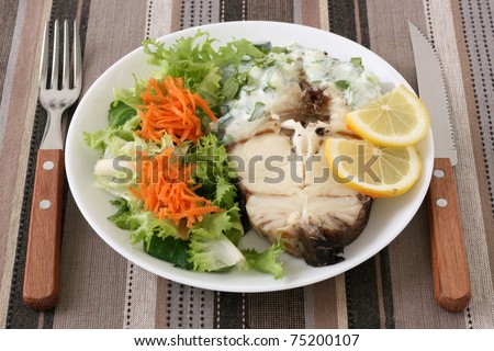 boiled fish with salad and sauce