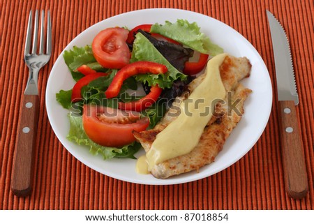 fried turkey with mustard sauce and salad