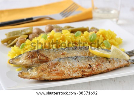 fried sardines with rice and vegetables